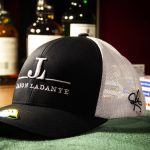 Hat with Jason Ladanye Logo